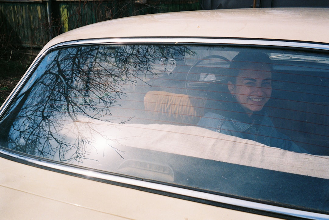 man in black jacket in car