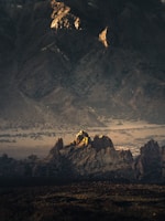 A visually compelling landscape with a play of shadows and light creating depth and mood.