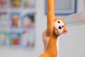 brown and white dog plush toy