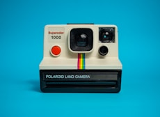 white and black polaroid instant camera