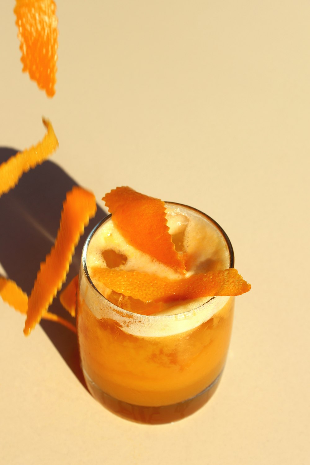 brown and white ice cream in clear glass cup