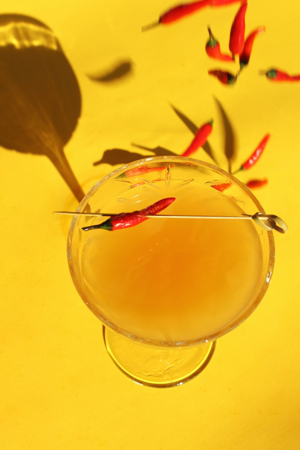 clear wine glass with yellow liquid