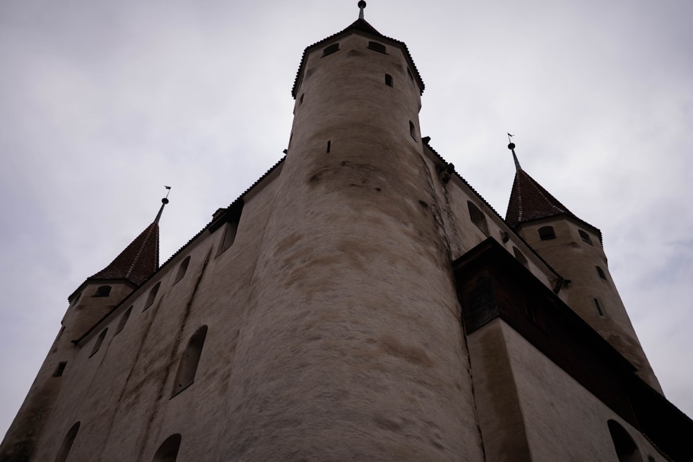 a tall tower with a clock on the top of it