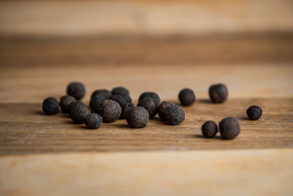 black round fruits on brown wooden table