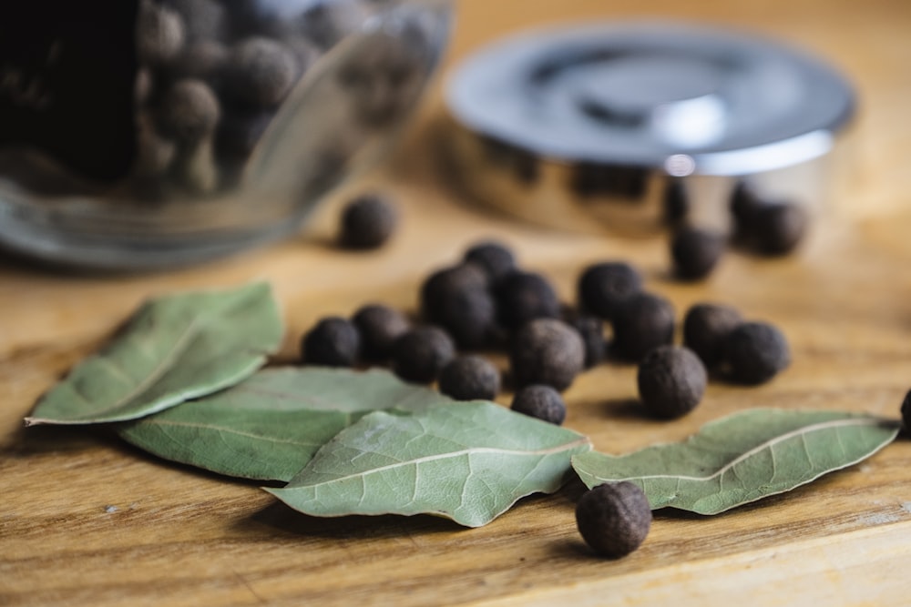 black round fruits on brown wooden table