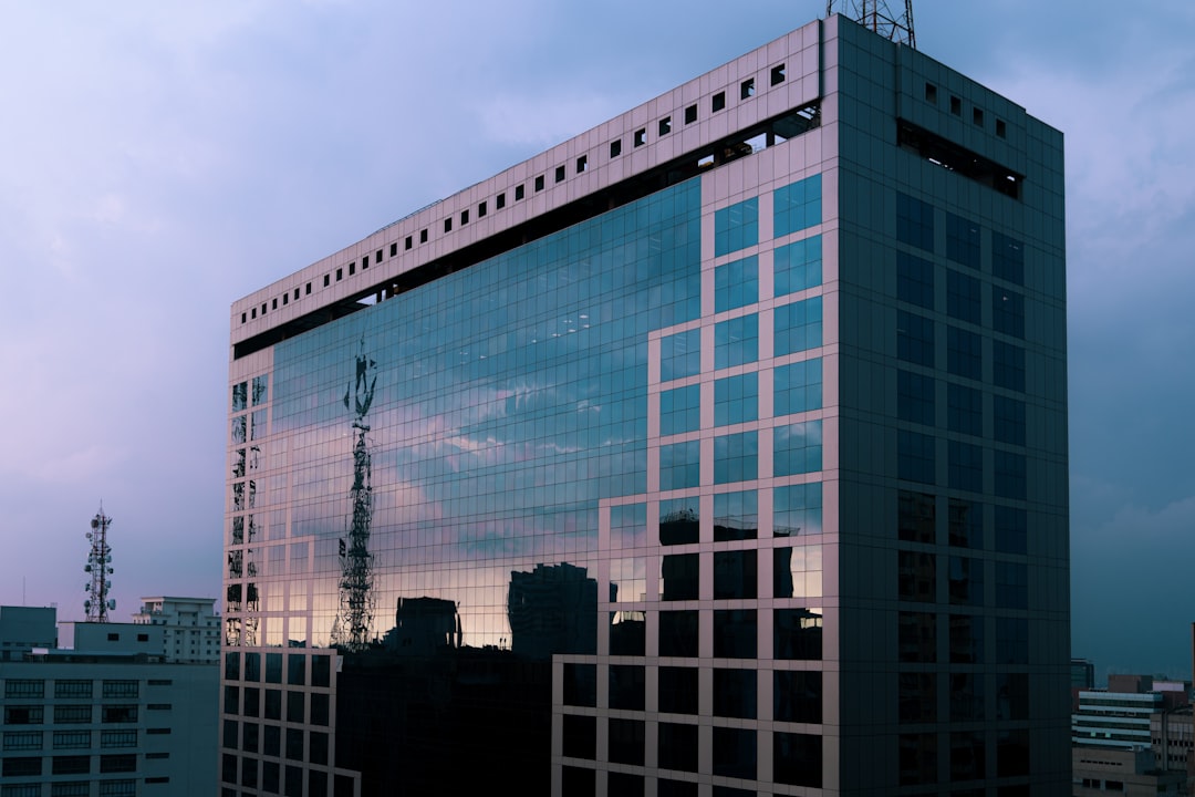 blue glass walled high rise building