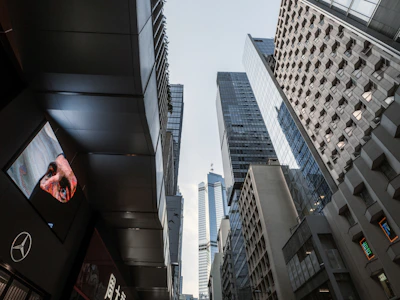 Abstract cityscape with upward arrows symbolizing business growth.