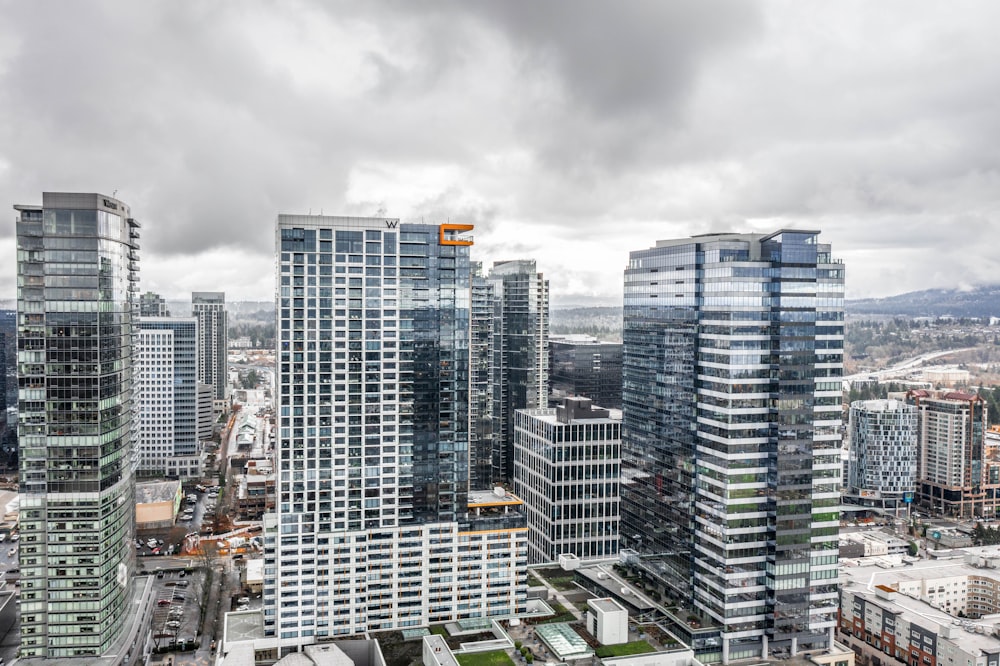 high rise buildings under gray sky during daytime