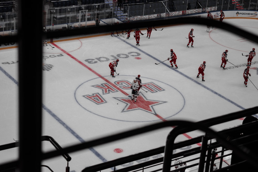 people playing ice hockey on ice field