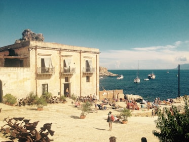 Cozy seaside guesthouse with sunlit balconies overlooking the Adriatic coast.