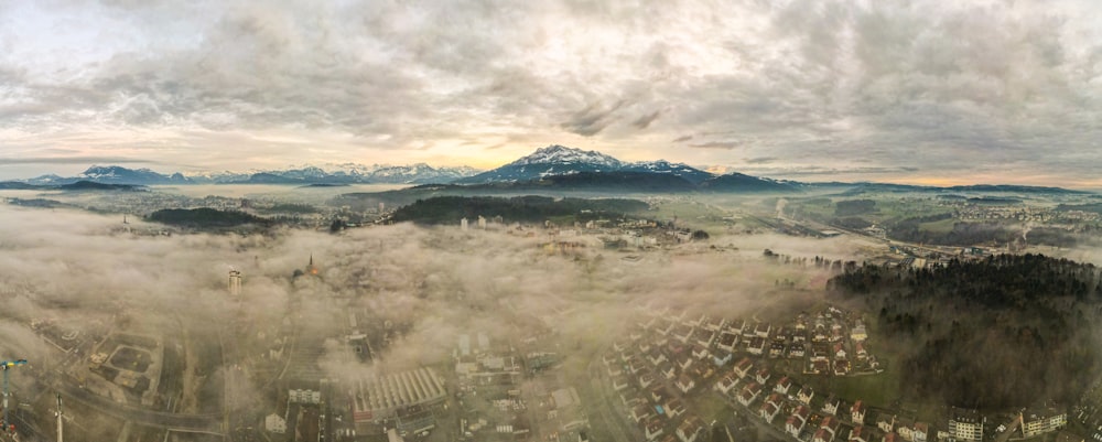 aerial view of city under cloudy sky during daytime