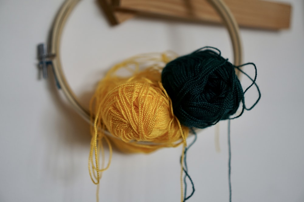 yellow yarn on white textile