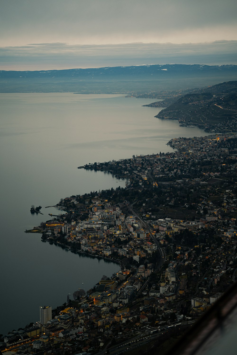 aerial view of city near body of water during daytime