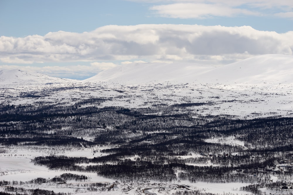 snow covered mountain during daytime