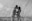 grayscale photo of man and woman kissing