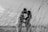 grayscale photo of man and woman kissing