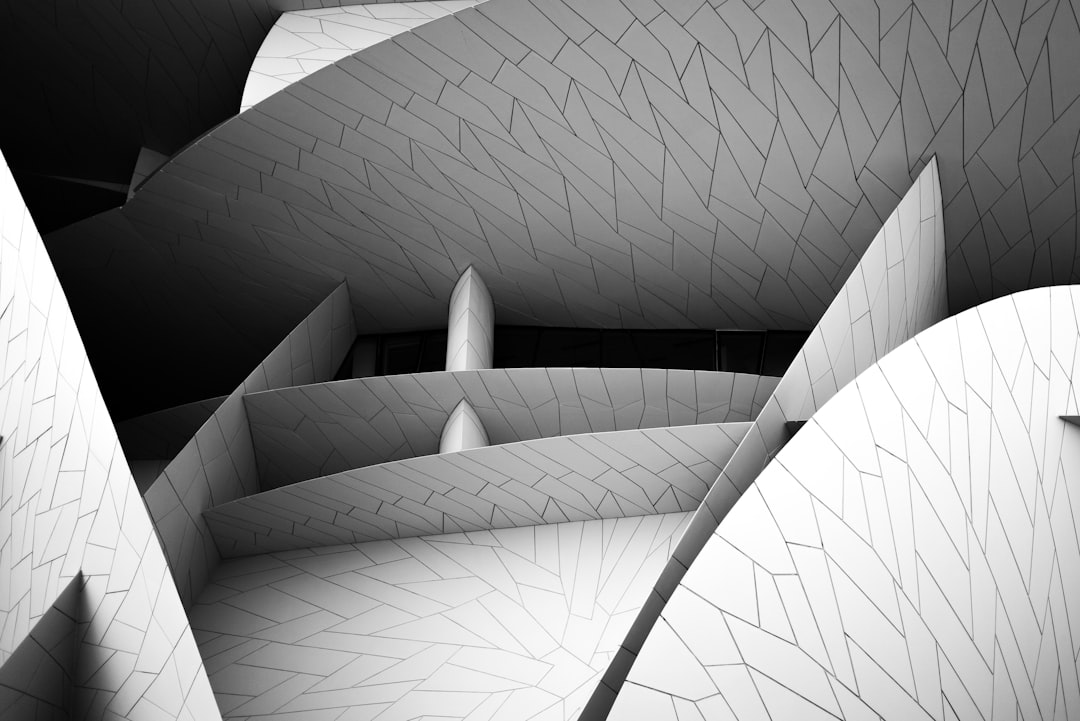 gray scale photo of spiral staircase, Qatar National Museum