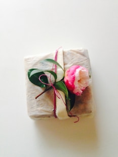 white and pink floral textile