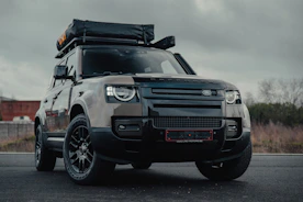 black ford suv on road during daytime
