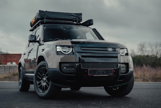 black ford suv on road during daytime