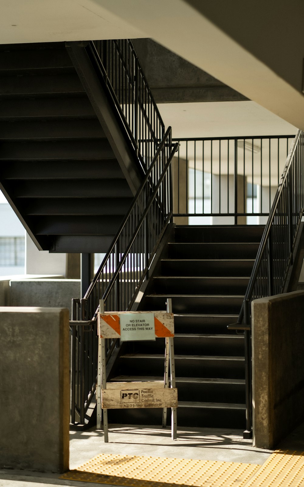 brown wooden table on gray concrete staircase