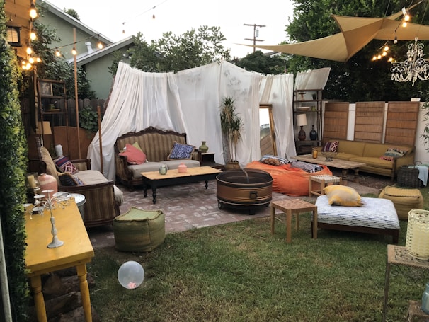 A cozy outdoor setup featuring barnums and comfortable seating for guests.