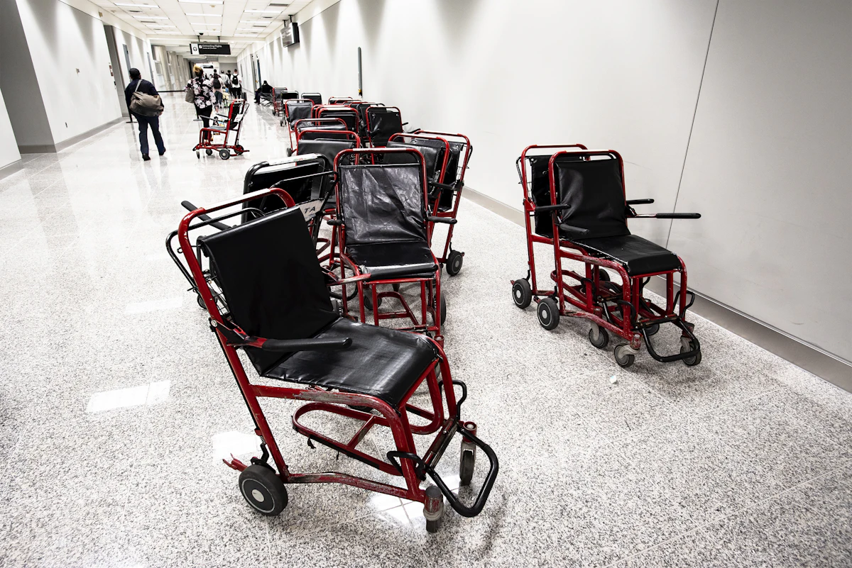 Airport assistance wheelchairs ready for passengers in a terminal
