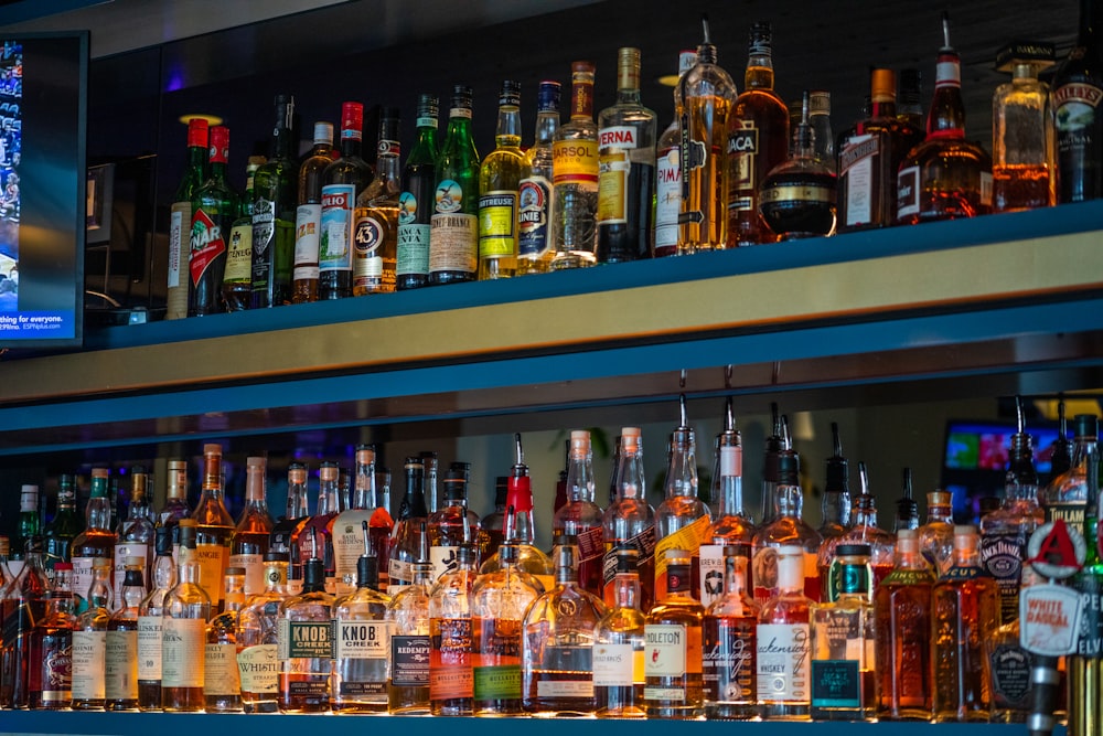 assorted glass bottles on shelf