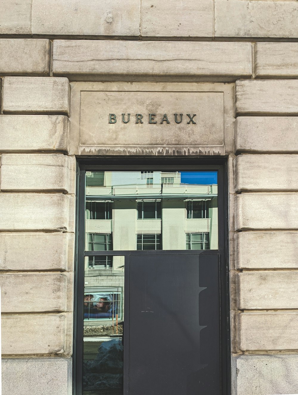 black wooden door with glass