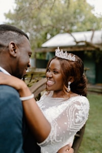 woman in white floral wedding gown smiling