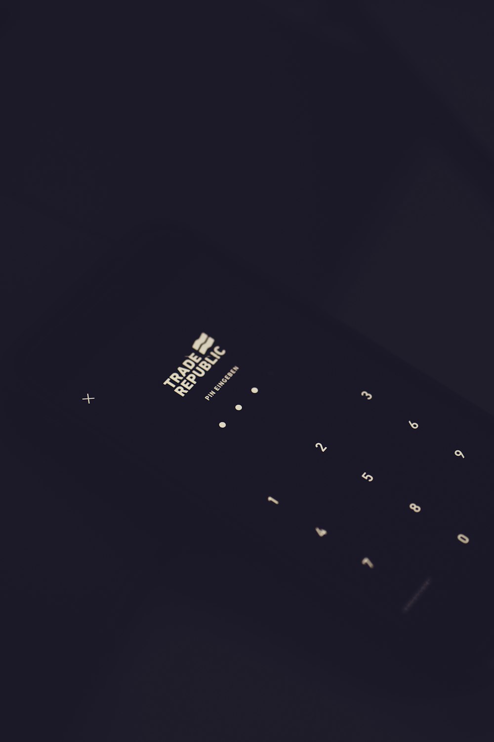 black qwerty phone on black textile