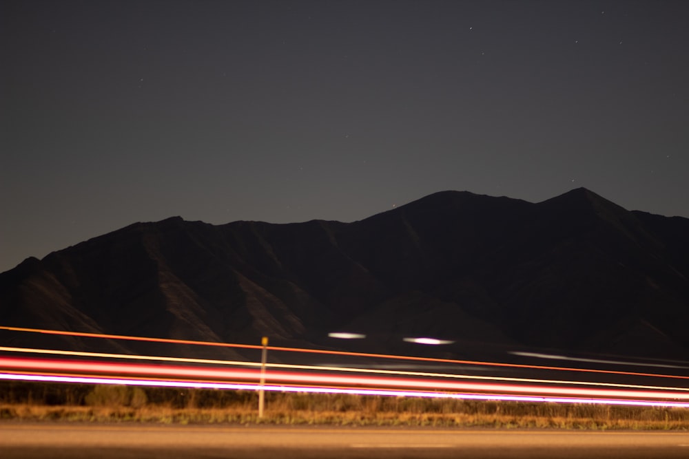 time lapse photography of road during night time