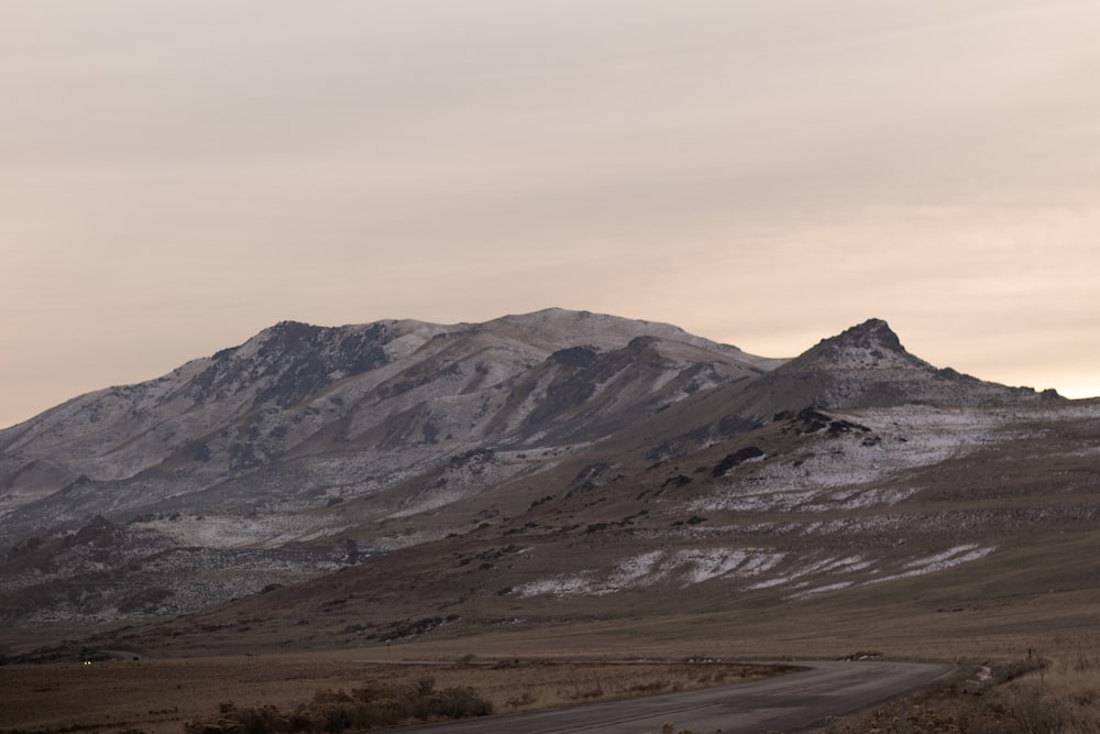 brown and gray mountains under white sky during daytime