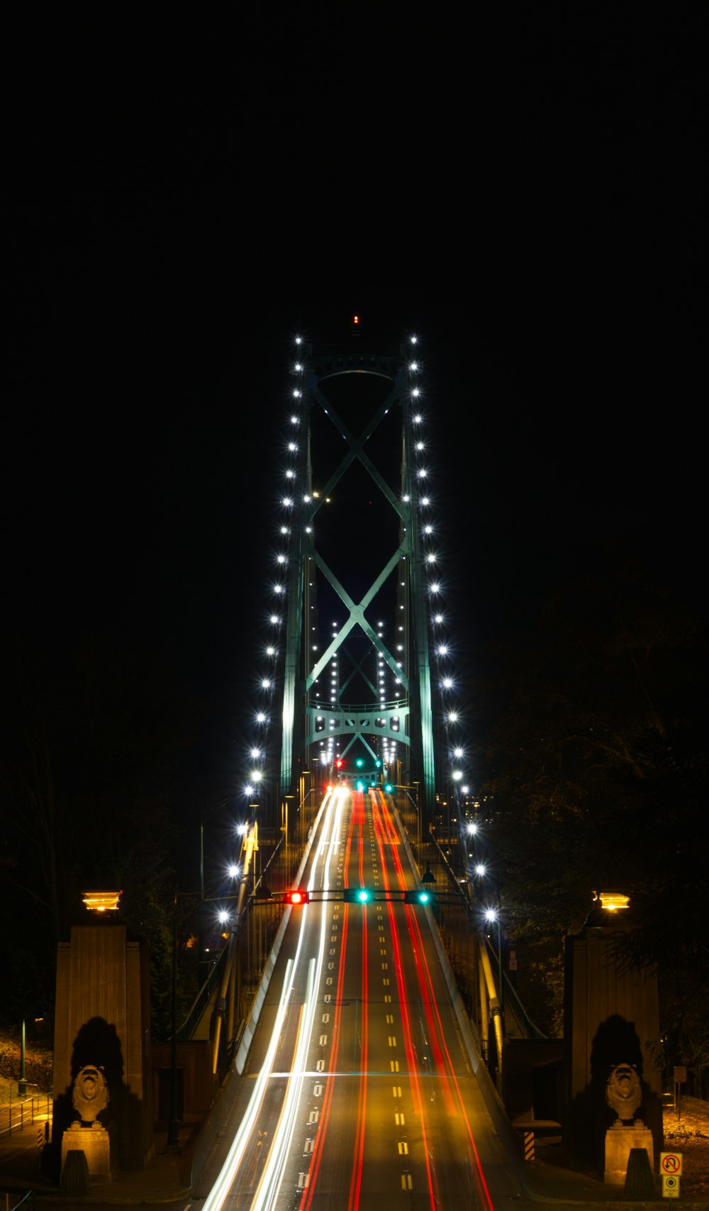 blue lighted bridge during night time