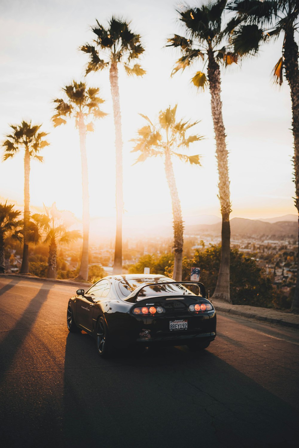 black porsche 911 on road during sunset