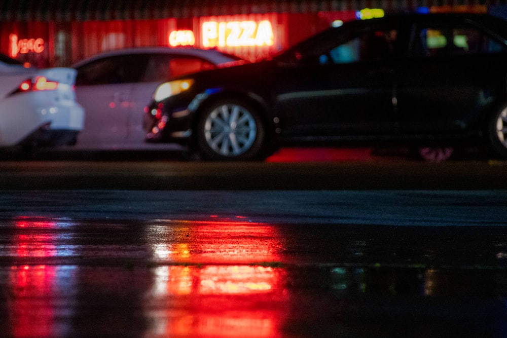 black sedan on road during night time