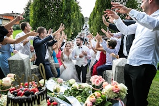 people standing and sitting on chair during daytime