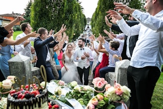 people standing and sitting on chair during daytime