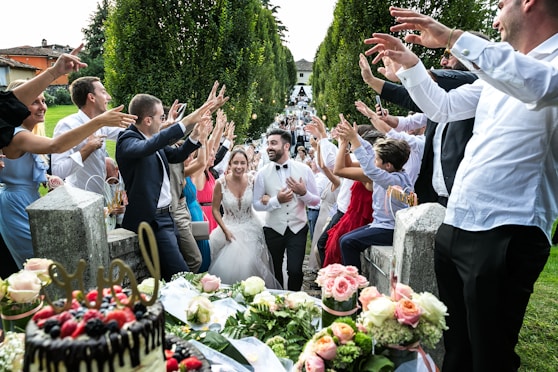 people standing and sitting on chair during daytime