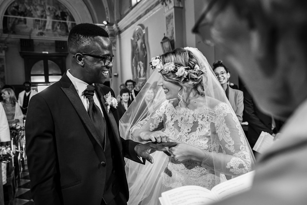 bride and groom in gray scale