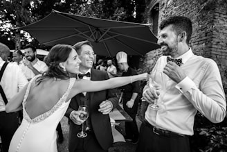 grayscale photo of man and woman kissing