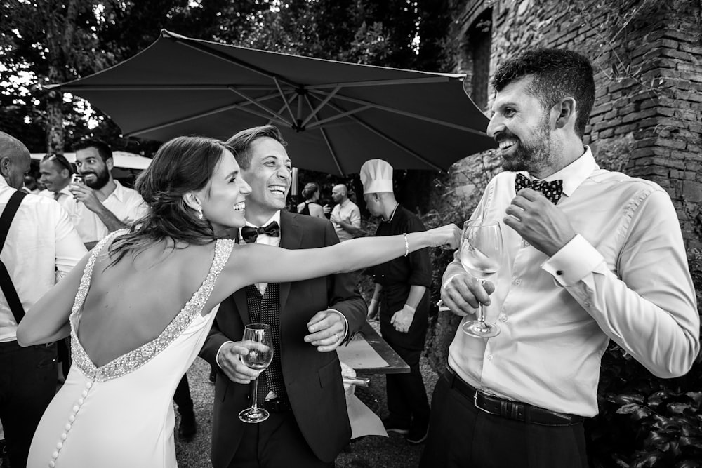 grayscale photo of man and woman kissing