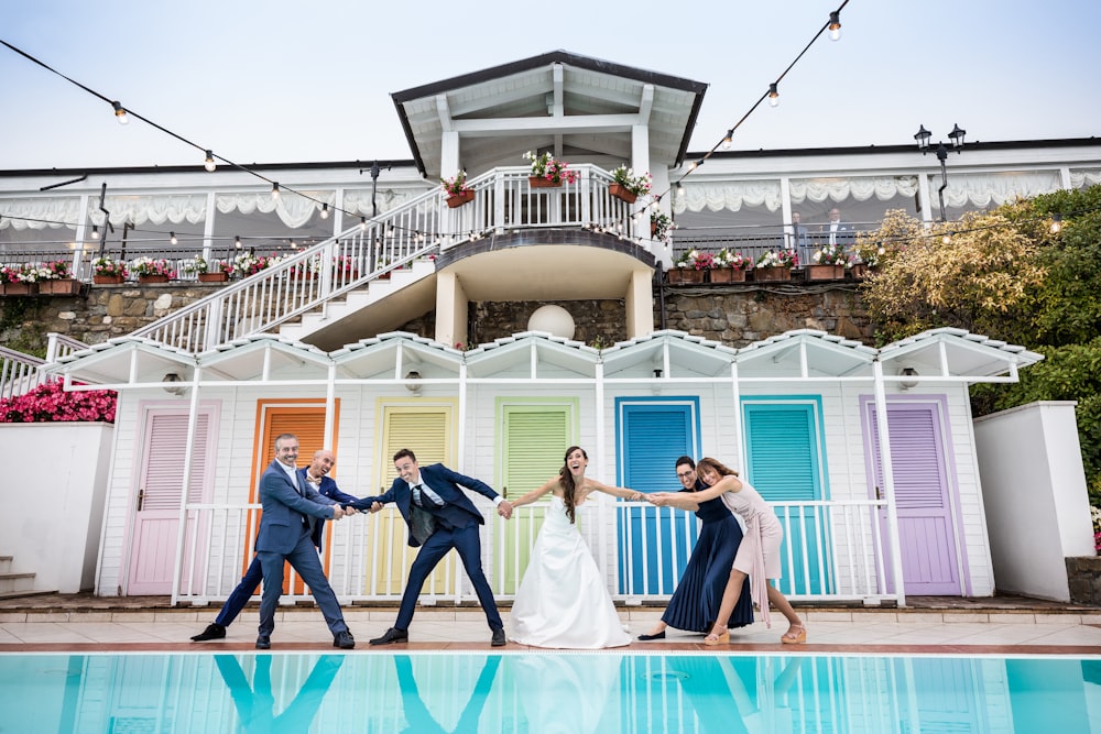 man and woman dancing on blue floor tiles during daytime