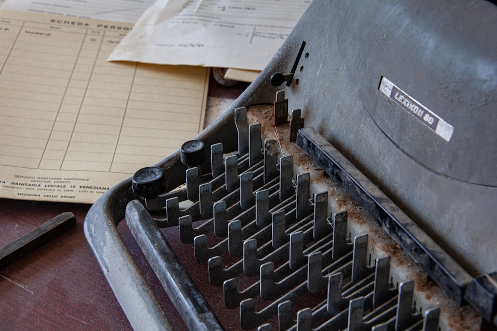 black typewriter on white printer paper