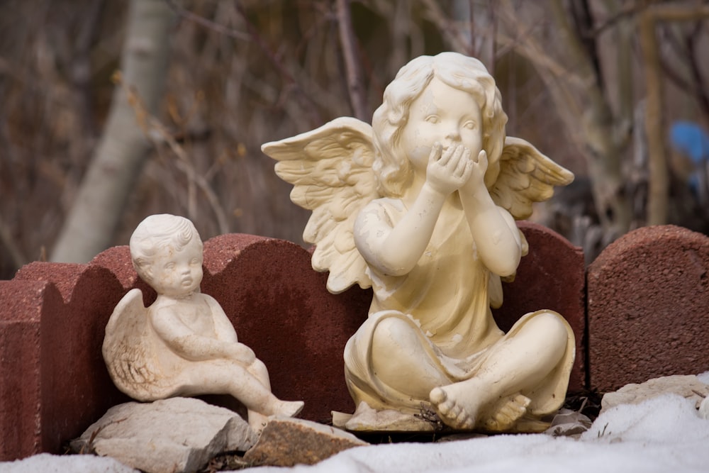 angel ceramic figurine on brown wooden table
