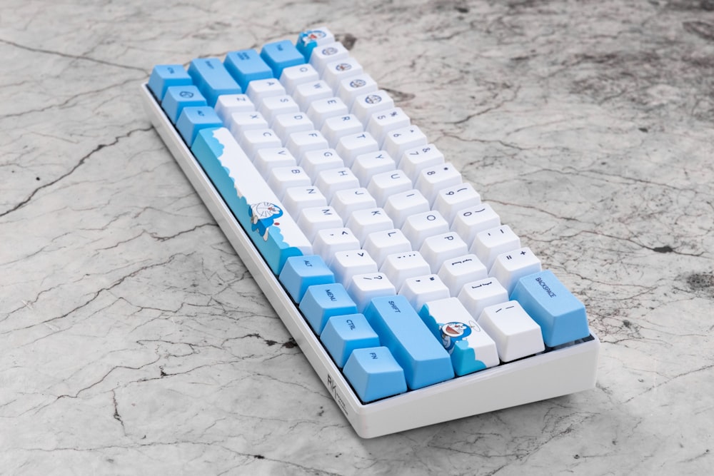 white and blue computer keyboard