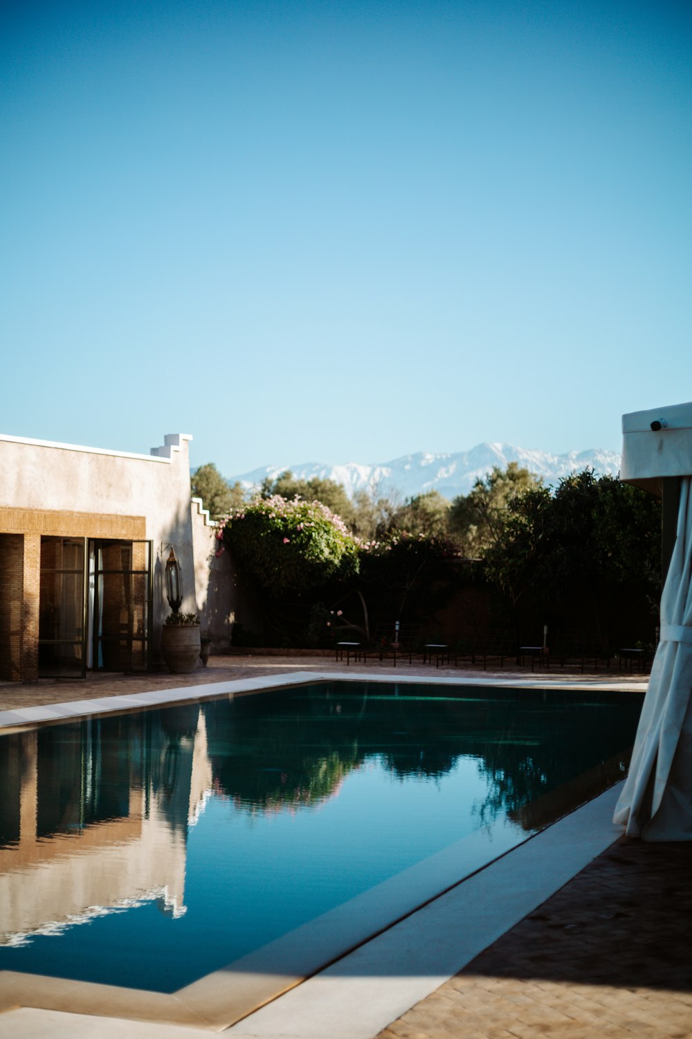 white concrete building near swimming pool during daytime