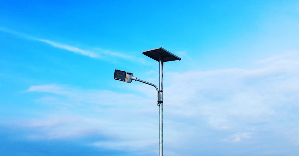 black street light under blue sky during daytime