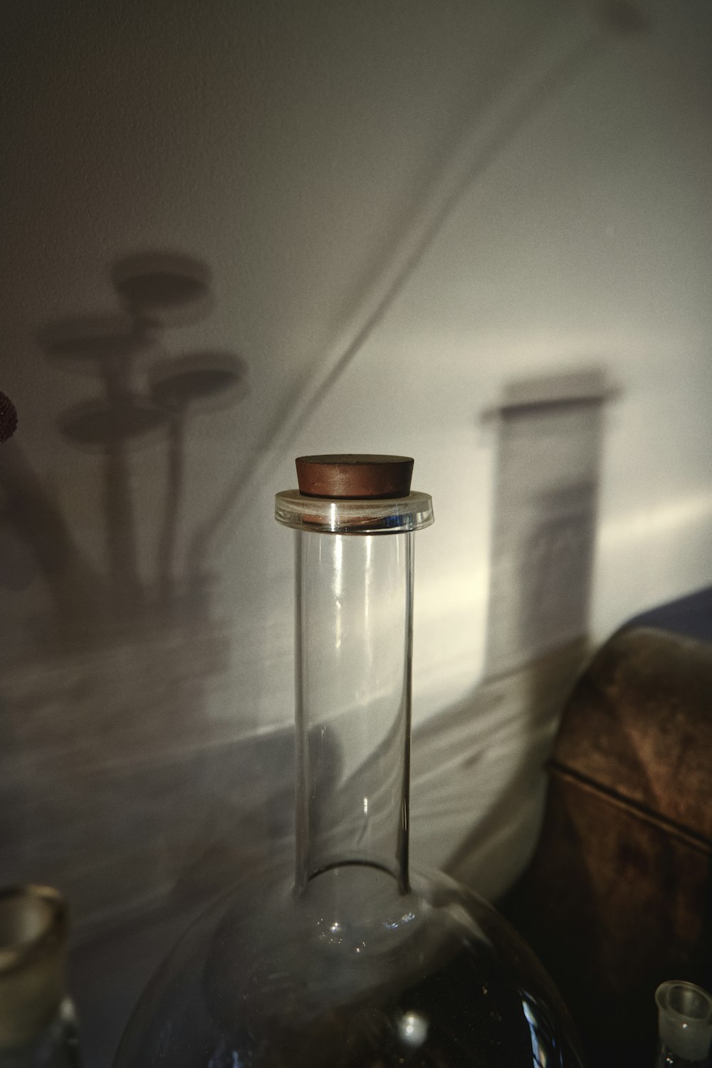 clear glass jar with brown lid