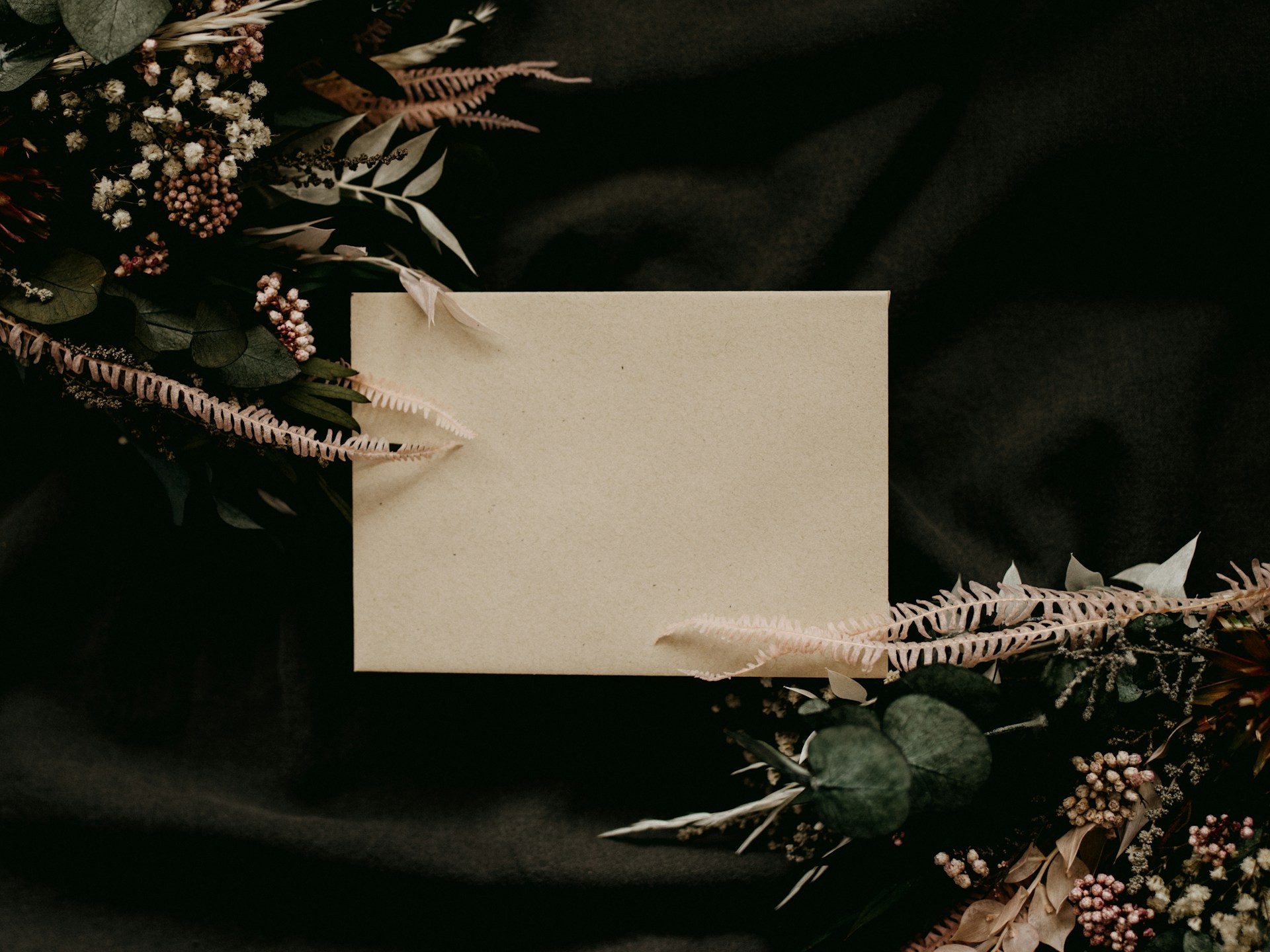 white paper with green and brown flower